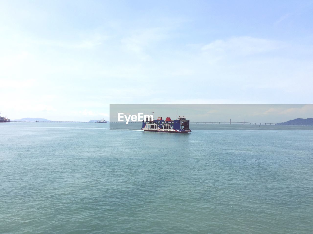 NAUTICAL VESSEL SAILING ON SEA AGAINST SKY