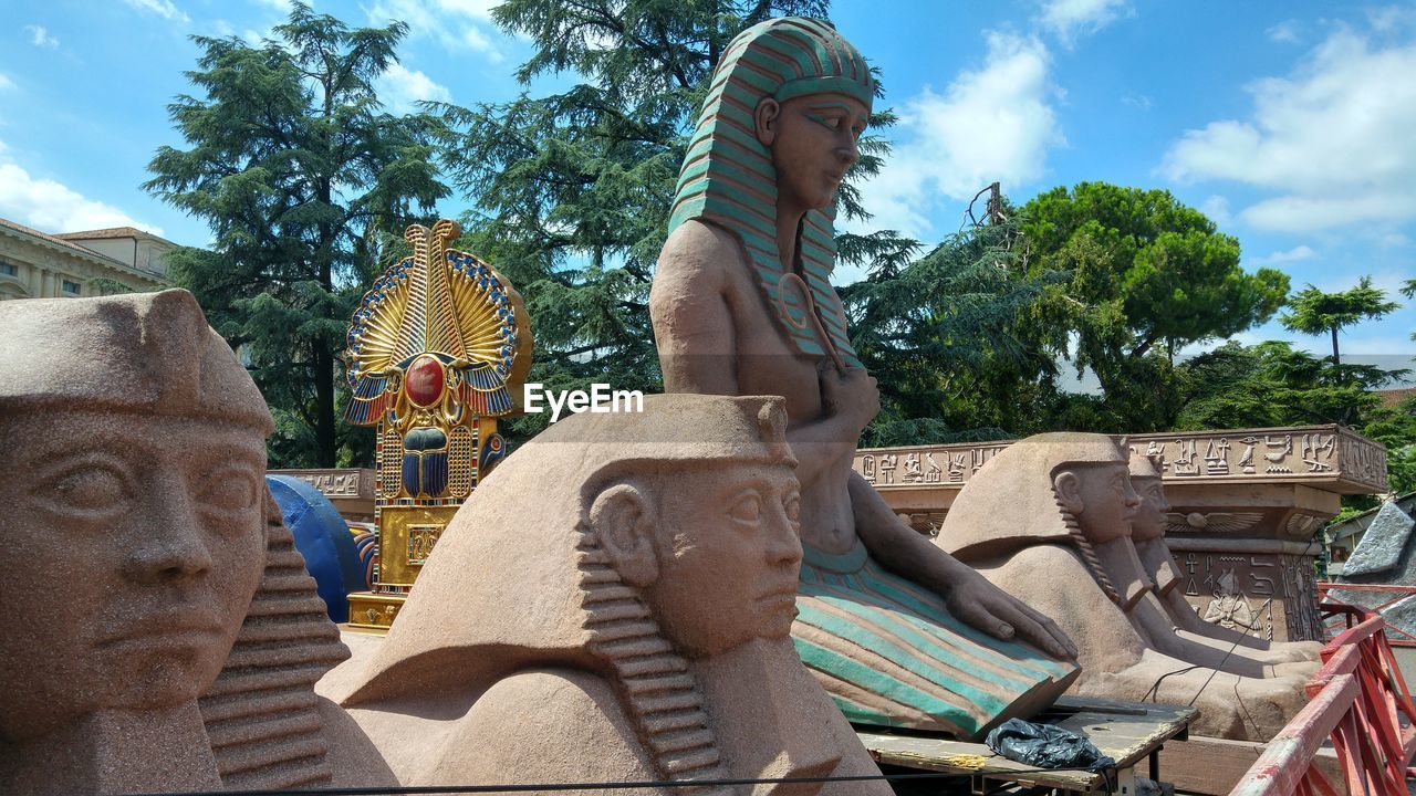 STATUES AGAINST SKY