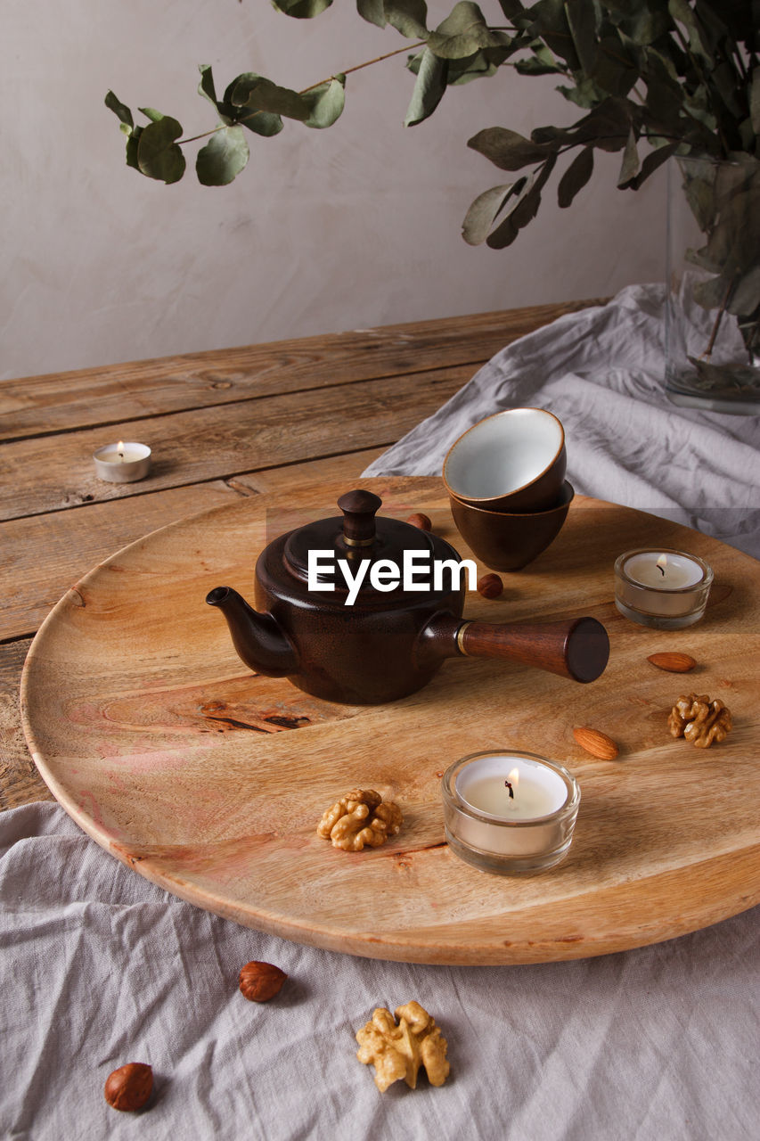 COFFEE CUP ON TABLE AT CAFE