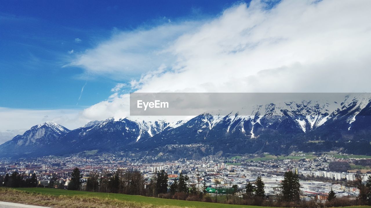 Panoramic view of snowcapped mountains against sky