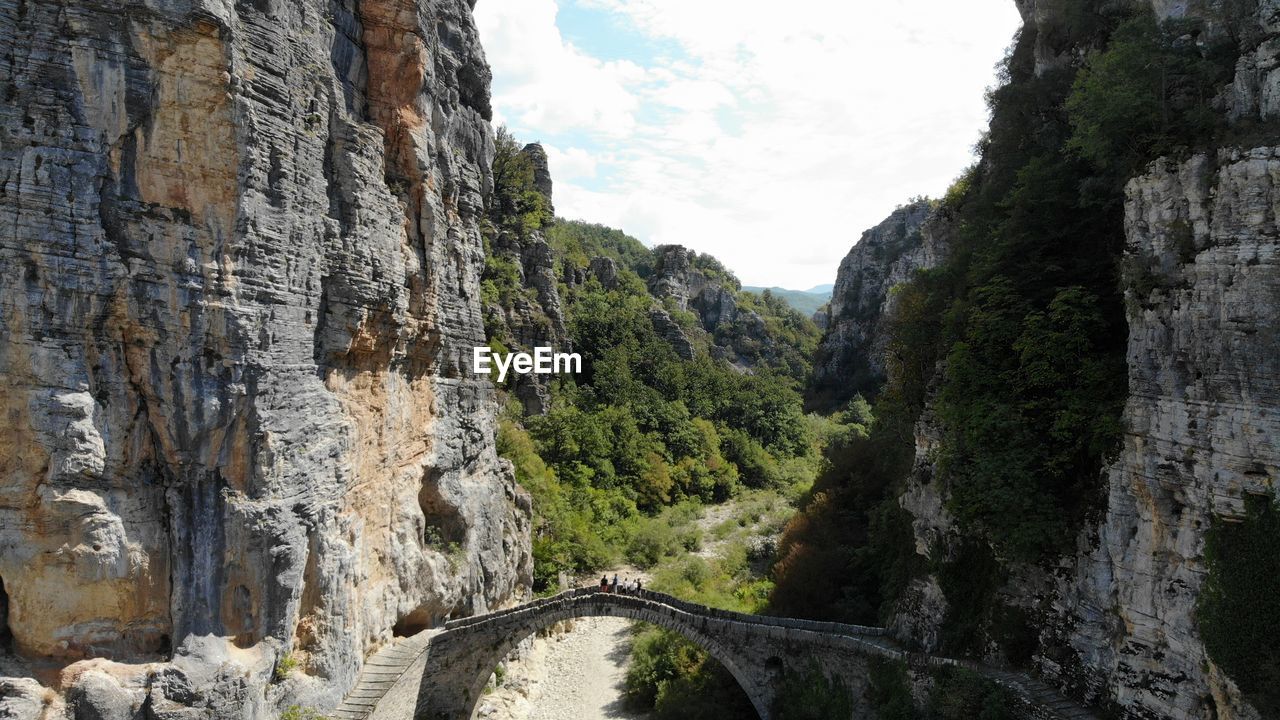 Panoramic view of bridge amidst trees against sky