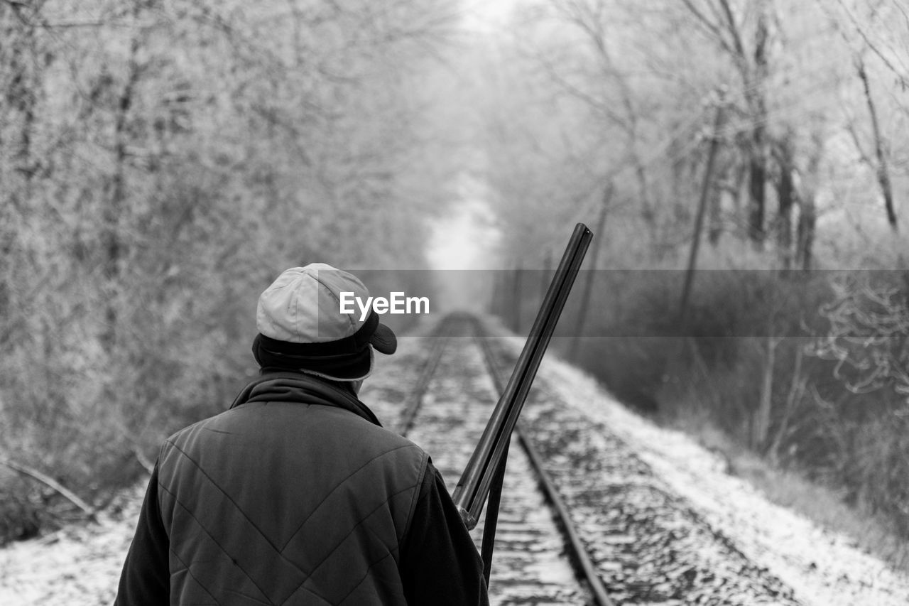 A hunter watching the trail rails
