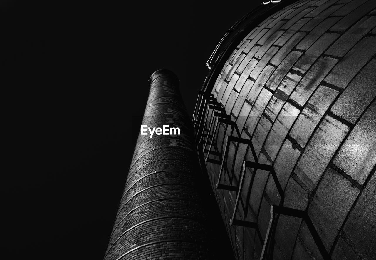 LOW ANGLE VIEW OF SMOKE STACK