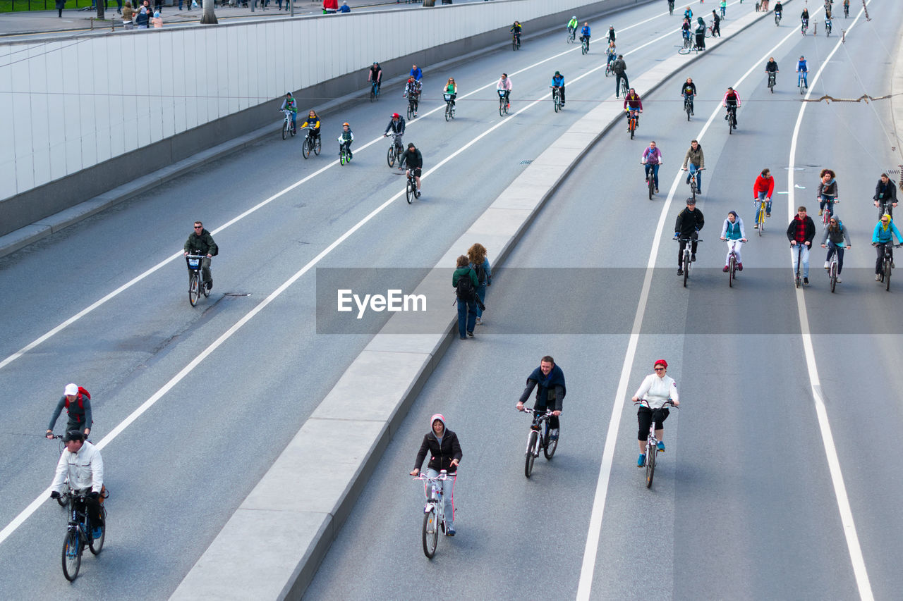 High angle view of people riding bicycles on road