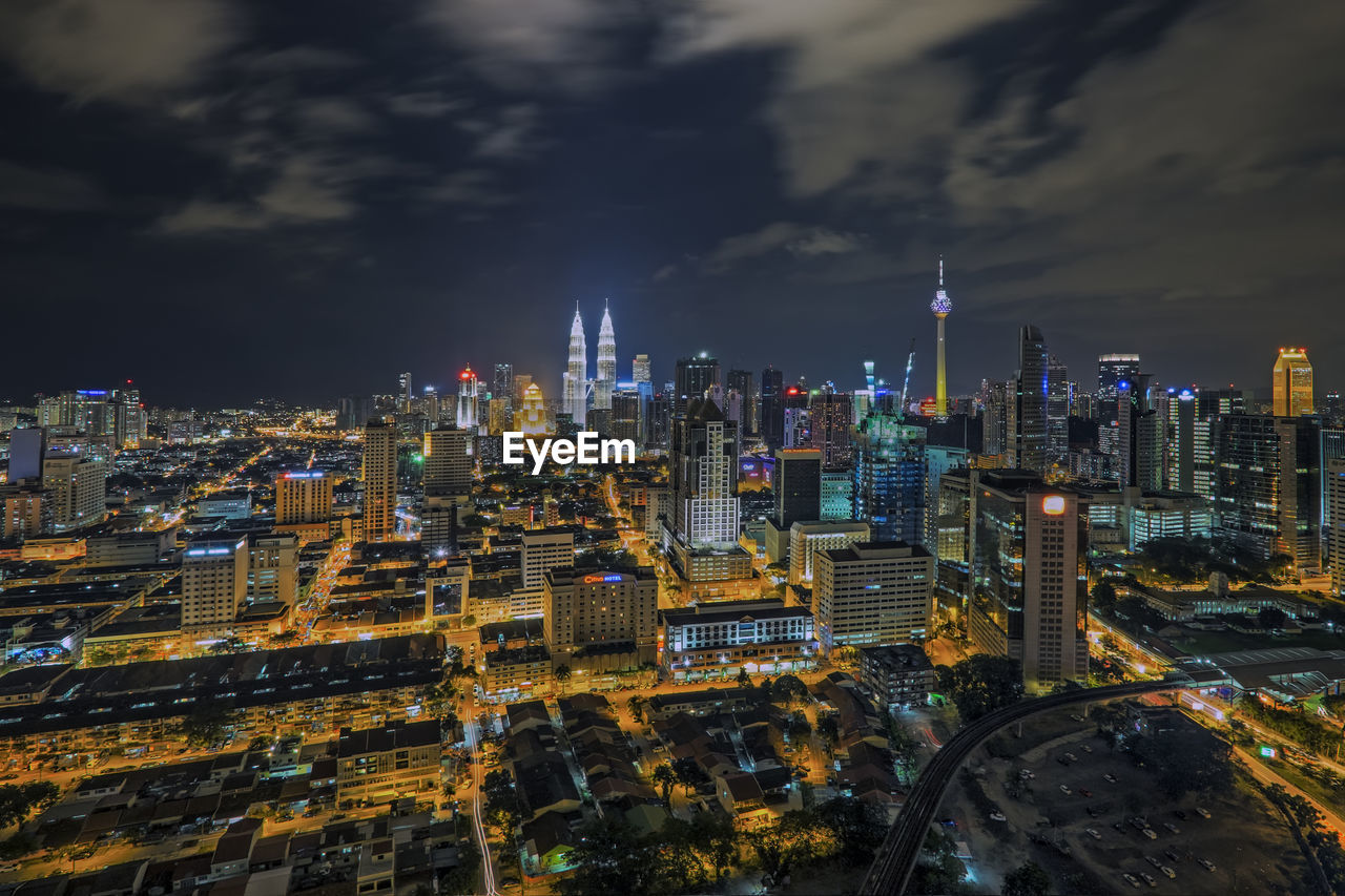 Aerial view of city lit up at night