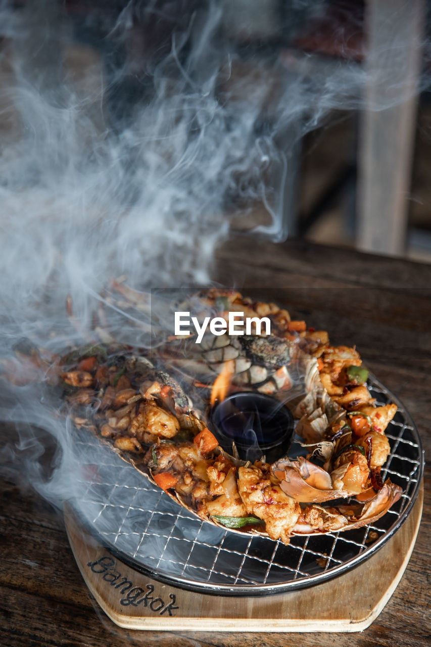 Close-up of meat on barbecue grill