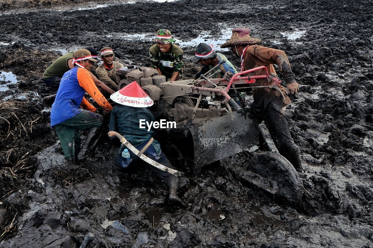 nature, day, land, group of people, water, men, soil, person, outdoors, high angle view, occupation, working, vehicle, beach, full length, lifestyles, transportation, rock, adult