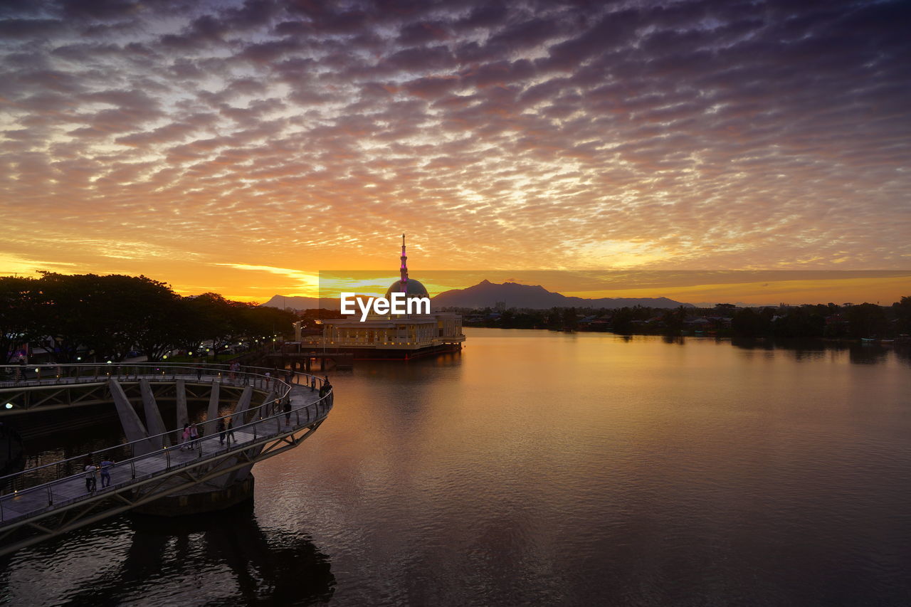 SCENIC VIEW OF RIVER AT SUNSET