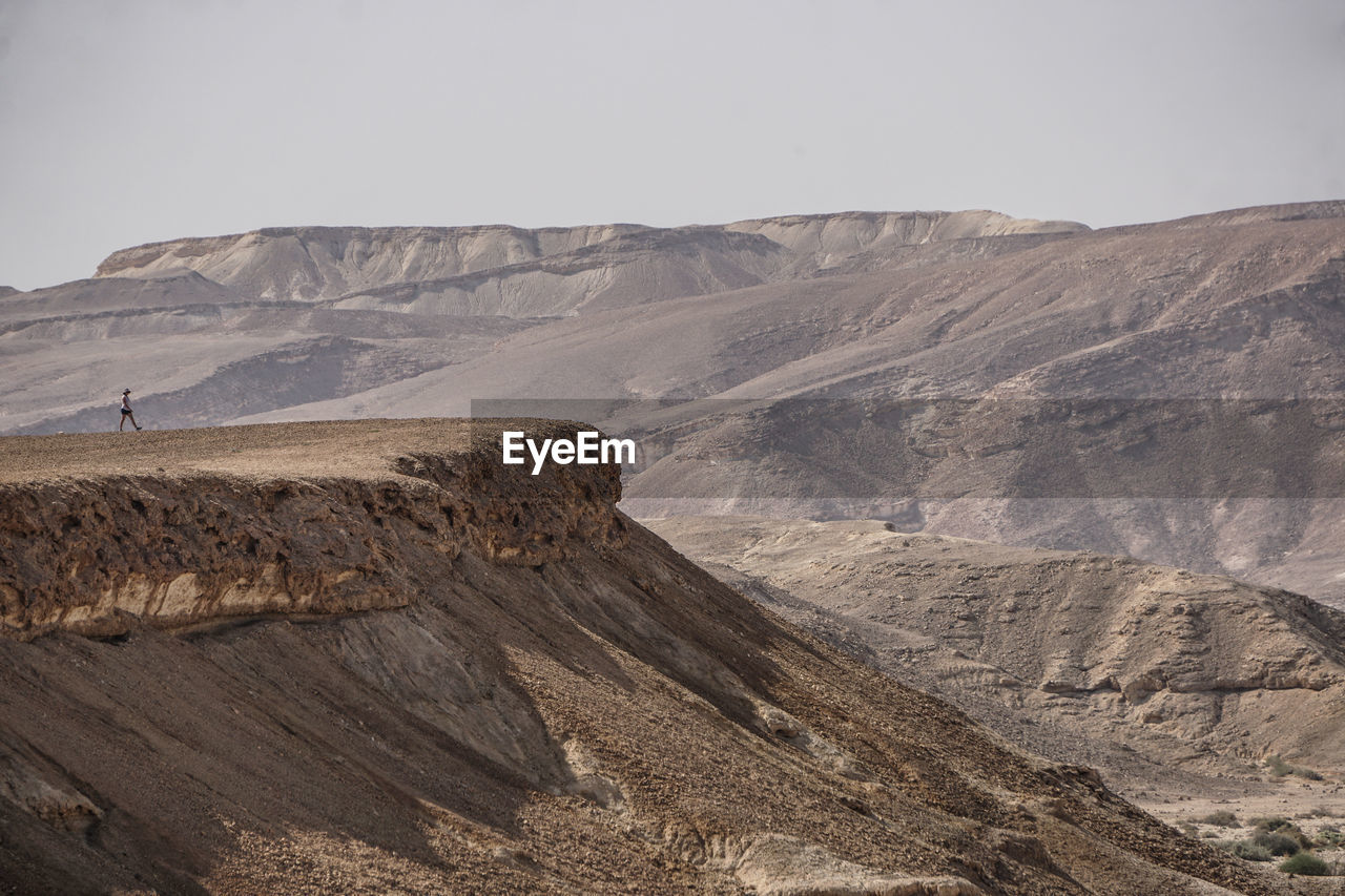 Woman standing on mountain