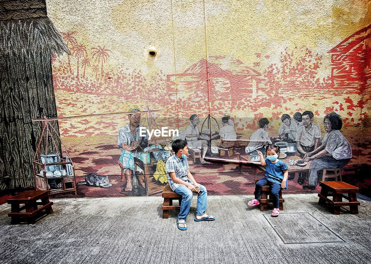 Group of people on wall