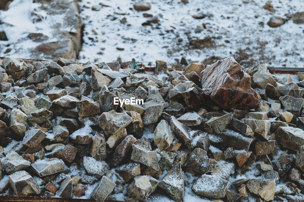 rock, wood, day, no people, nature, winter, rubble, large group of objects, high angle view, abundance, leaf, frost, outdoors, soil, land, water, snow, geology, cold temperature, close-up