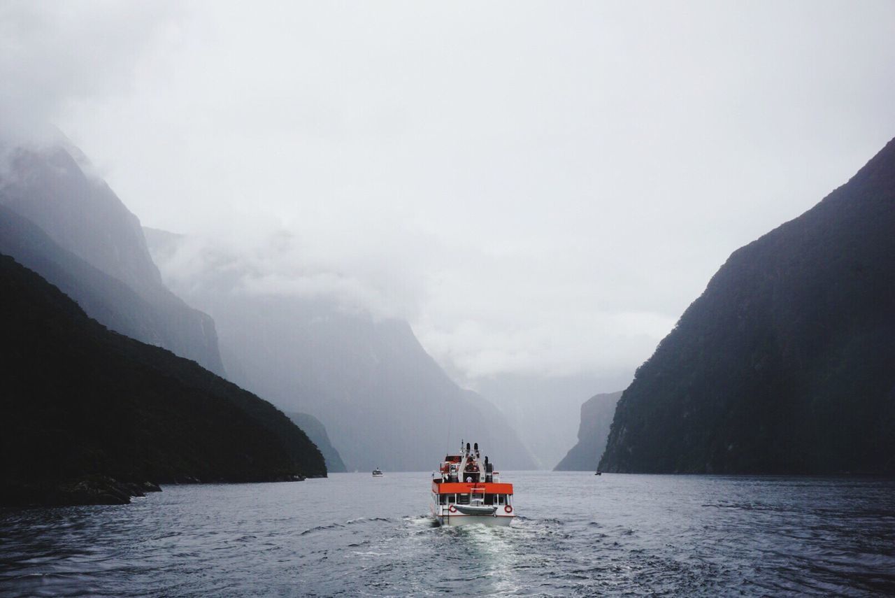 Scenic view of sea against mountain