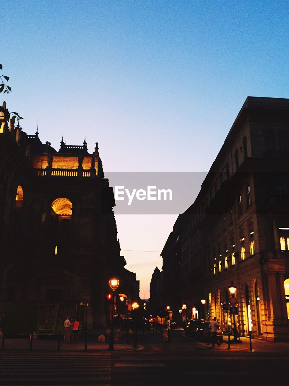 VIEW OF CITY STREET AT DUSK