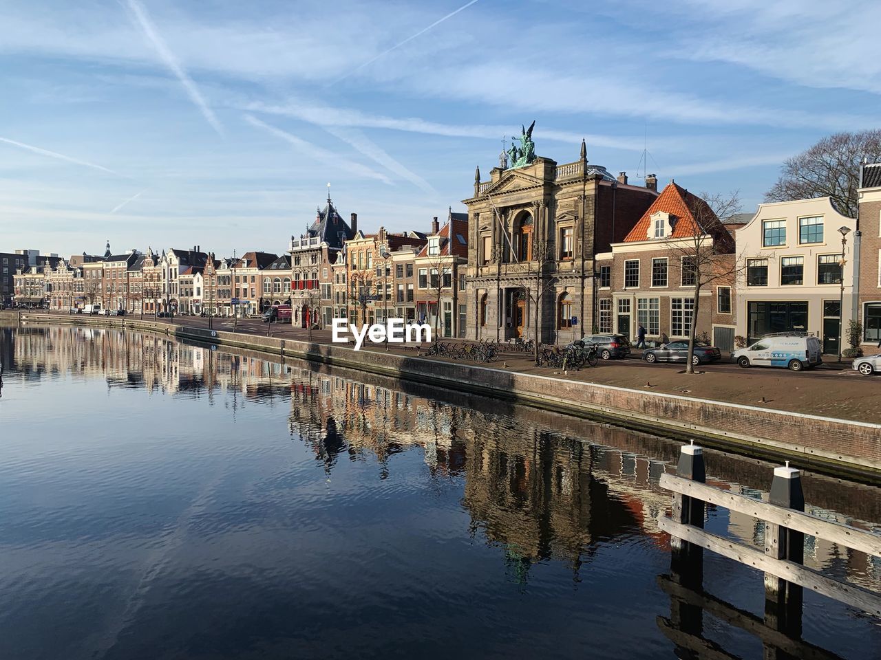 CANAL BY BUILDINGS AGAINST SKY