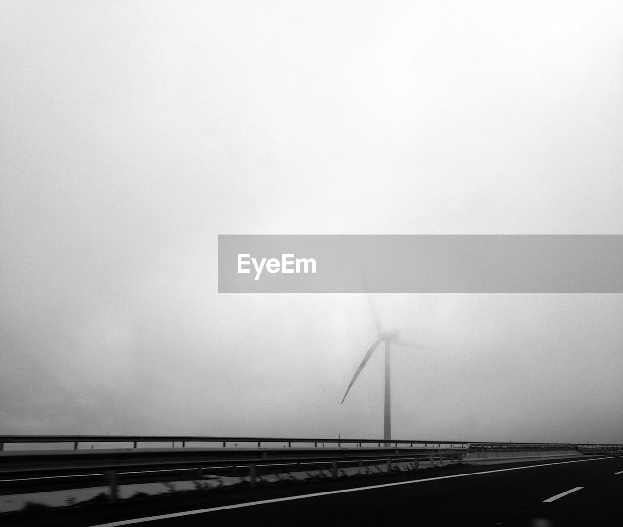 Lone wind turbine against clear sky