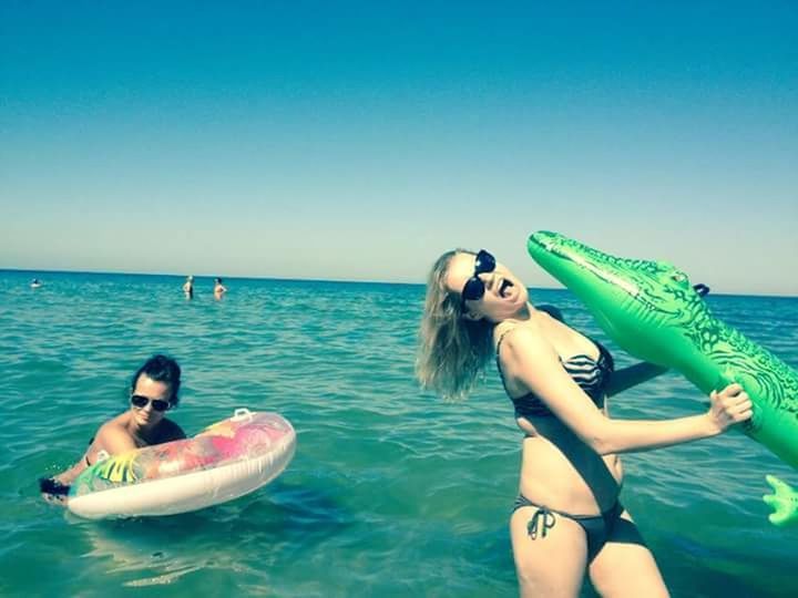 WOMAN SWIMMING IN SEA