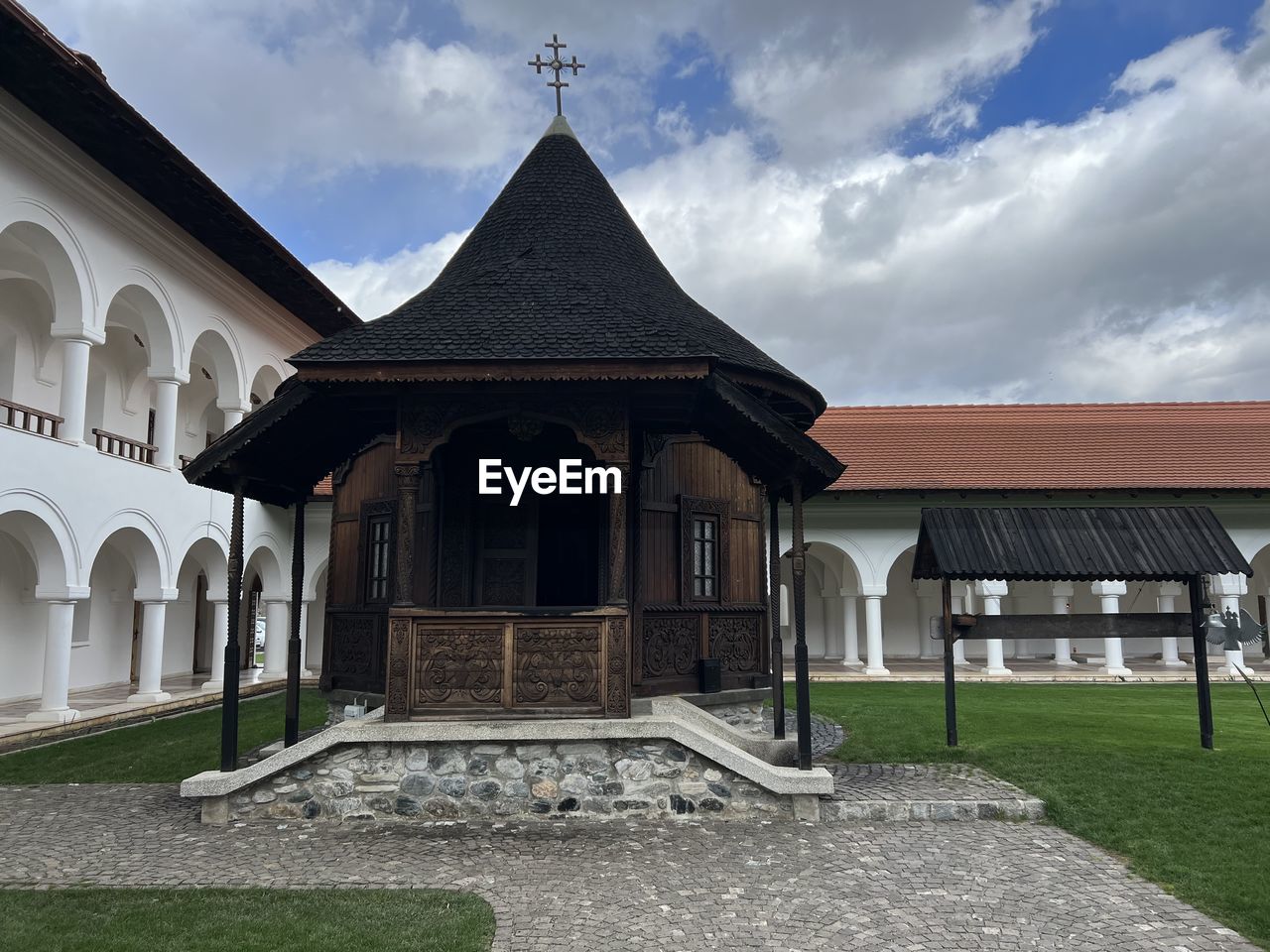 architecture, built structure, building exterior, building, cloud, sky, grass, religion, estate, nature, place of worship, belief, history, house, travel destinations, the past, no people, spirituality, outdoors, travel, landscape, facade, tourism, plant, environment