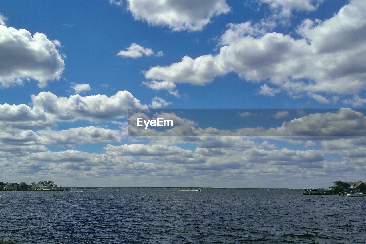 Overview of coastline with blue sky and clouds