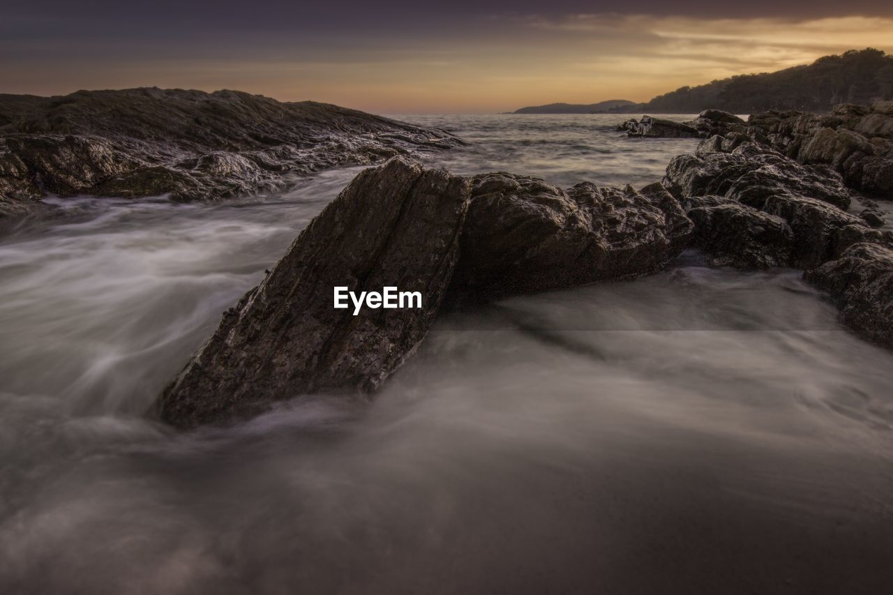 Scenic view of sea against sky during sunset