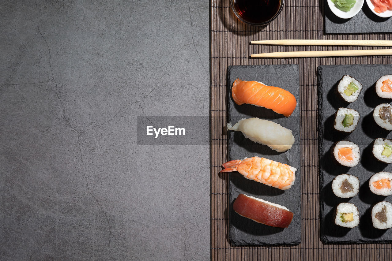 Variety of sushi on dark background. sushi set with copyspace.