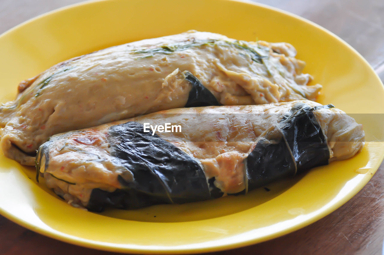 CLOSE-UP OF FISH SERVED IN PLATE WITH SAUCE