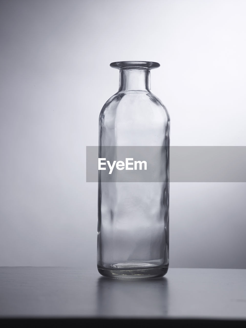 Empty bottle or container on the gray background