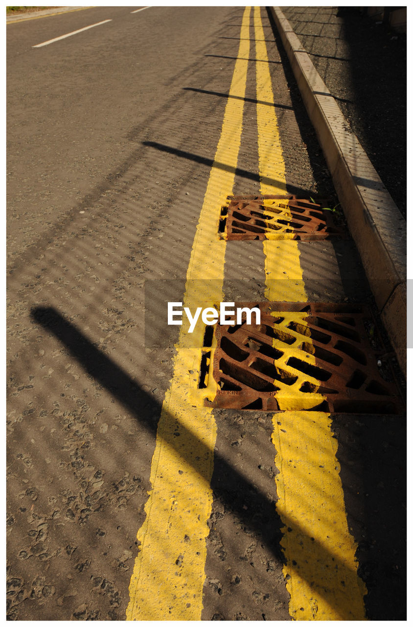 High angle view of sewers on road