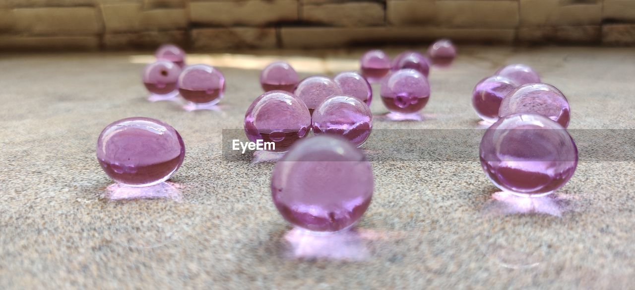 CLOSE-UP OF VARIOUS FLOWERS ON FLOOR