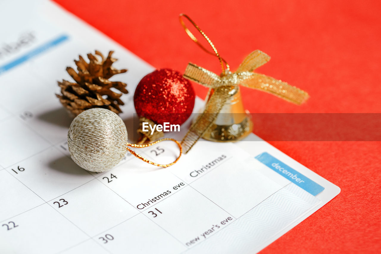 Page of planner calendar opened on december 24 christmas holiday. flat lay calendar with toys
