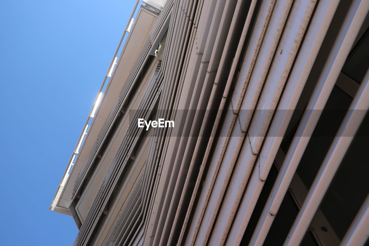 Low angle view of modern architectural  building against clear sky