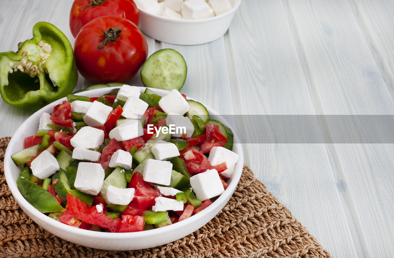 Bulgarian shopska type salad with tomato, cucumber, peppers and feta cheese