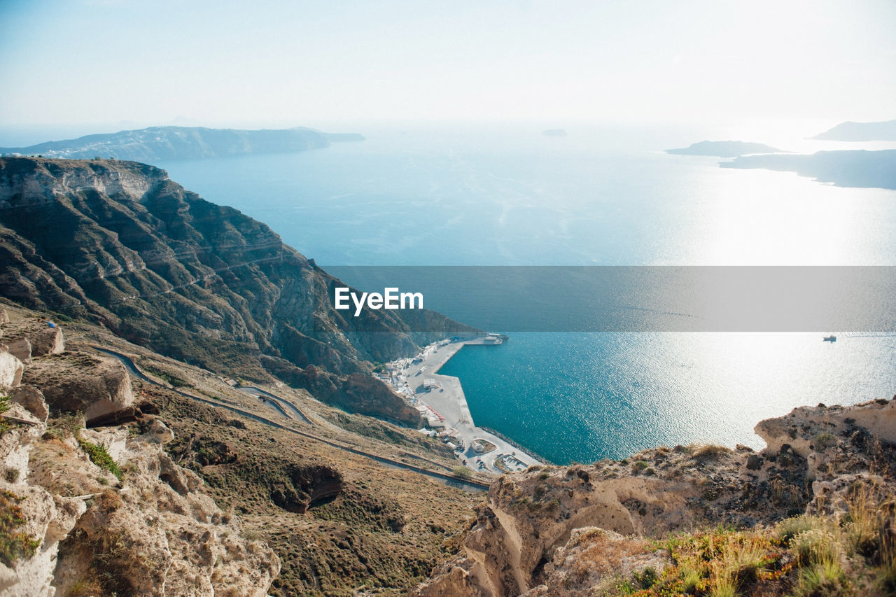 High angle view of rocks by sea against sky