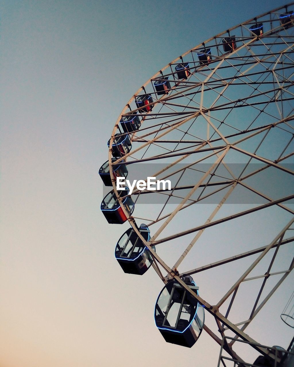 Low angle view of ferris wheel against clear sky