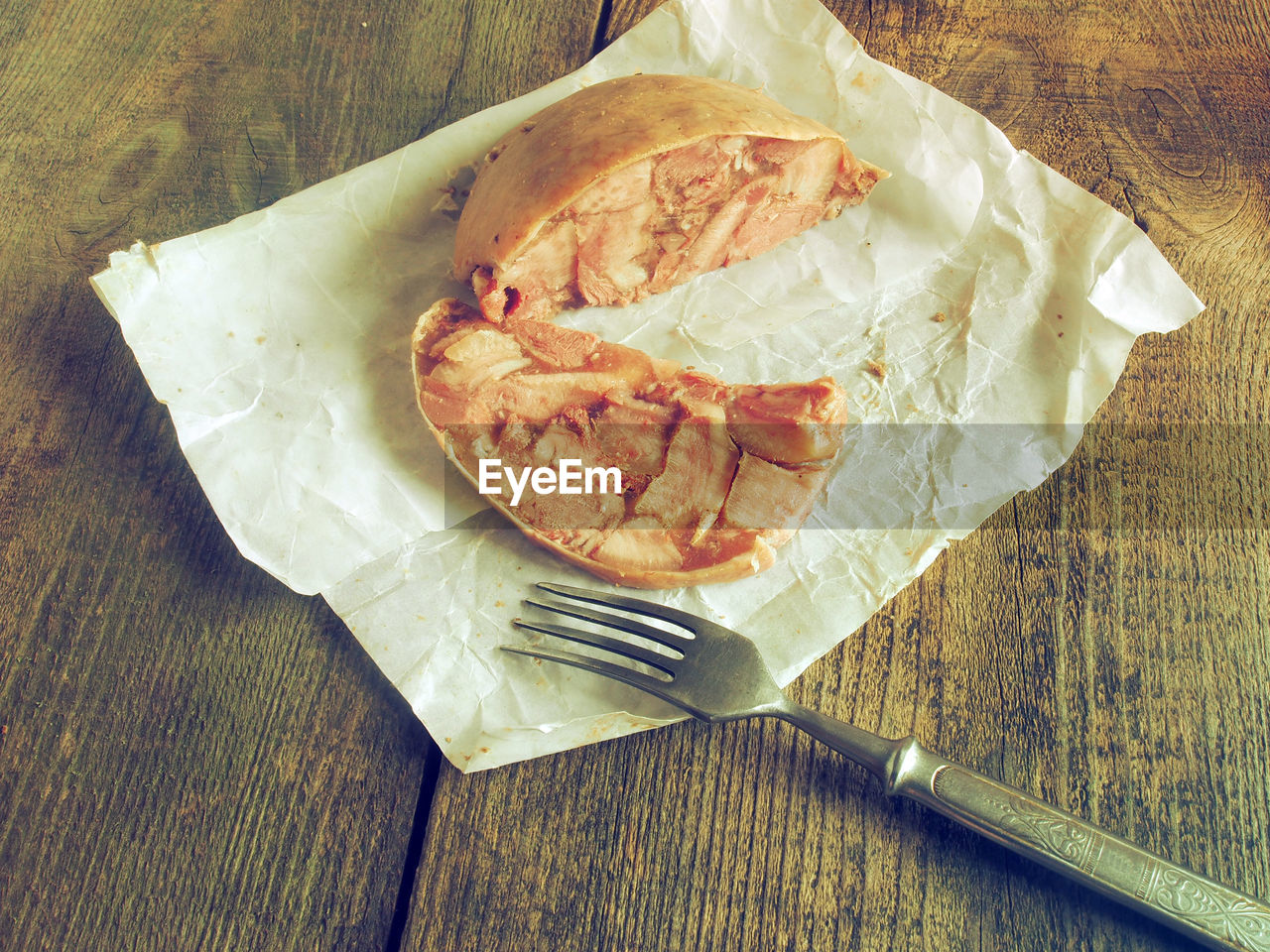 High angle view of burrito with fork on table