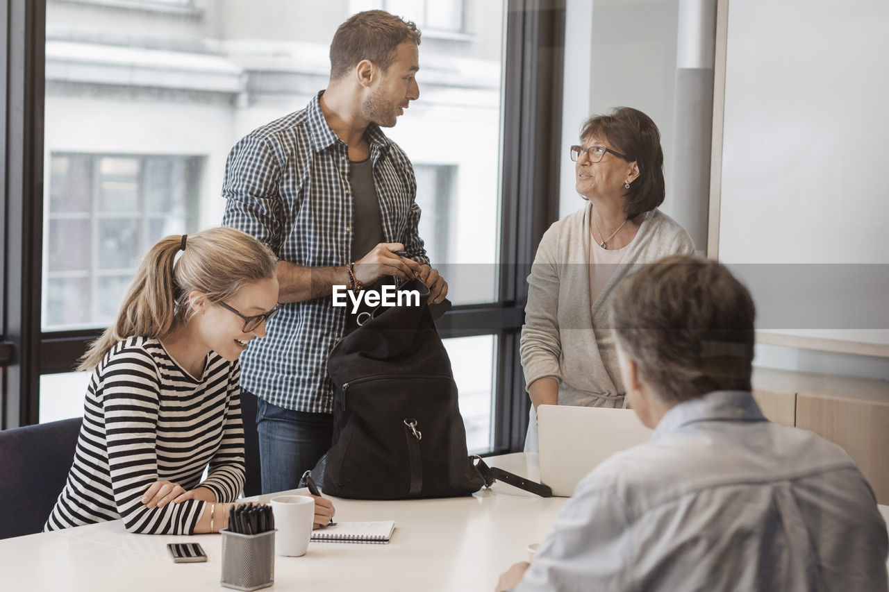 Business people discussing in board room