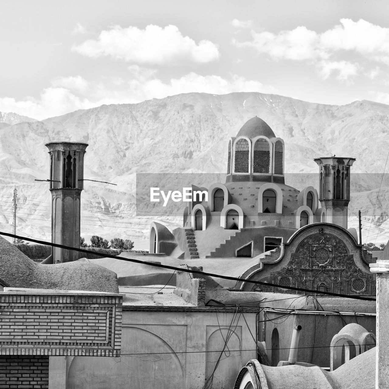 OLD BUILDINGS AGAINST SKY