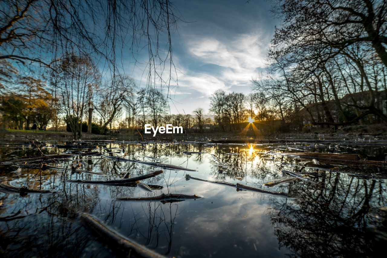 Scenic view of lake against sky during sunset