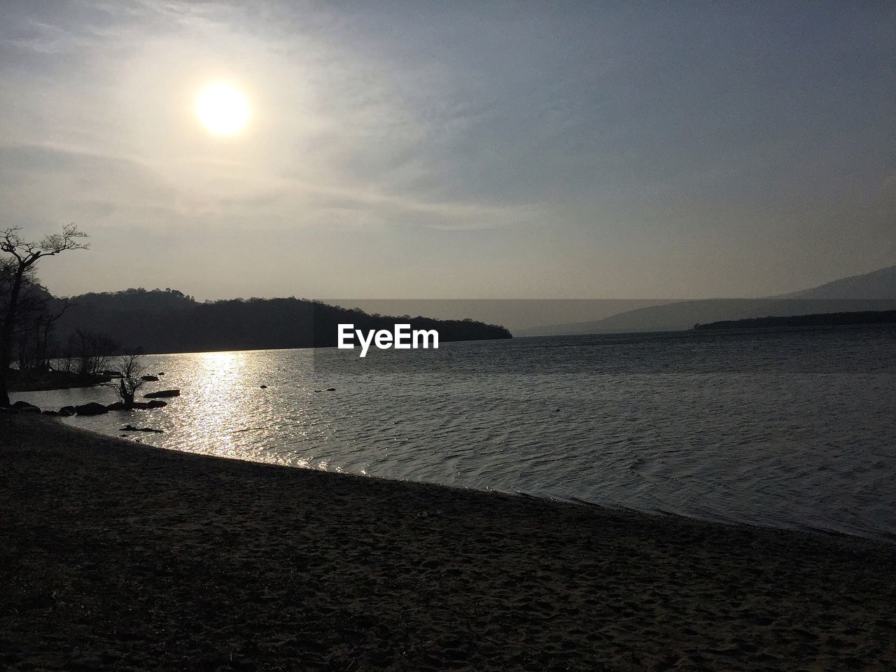 IDYLLIC VIEW OF BEACH AGAINST SKY