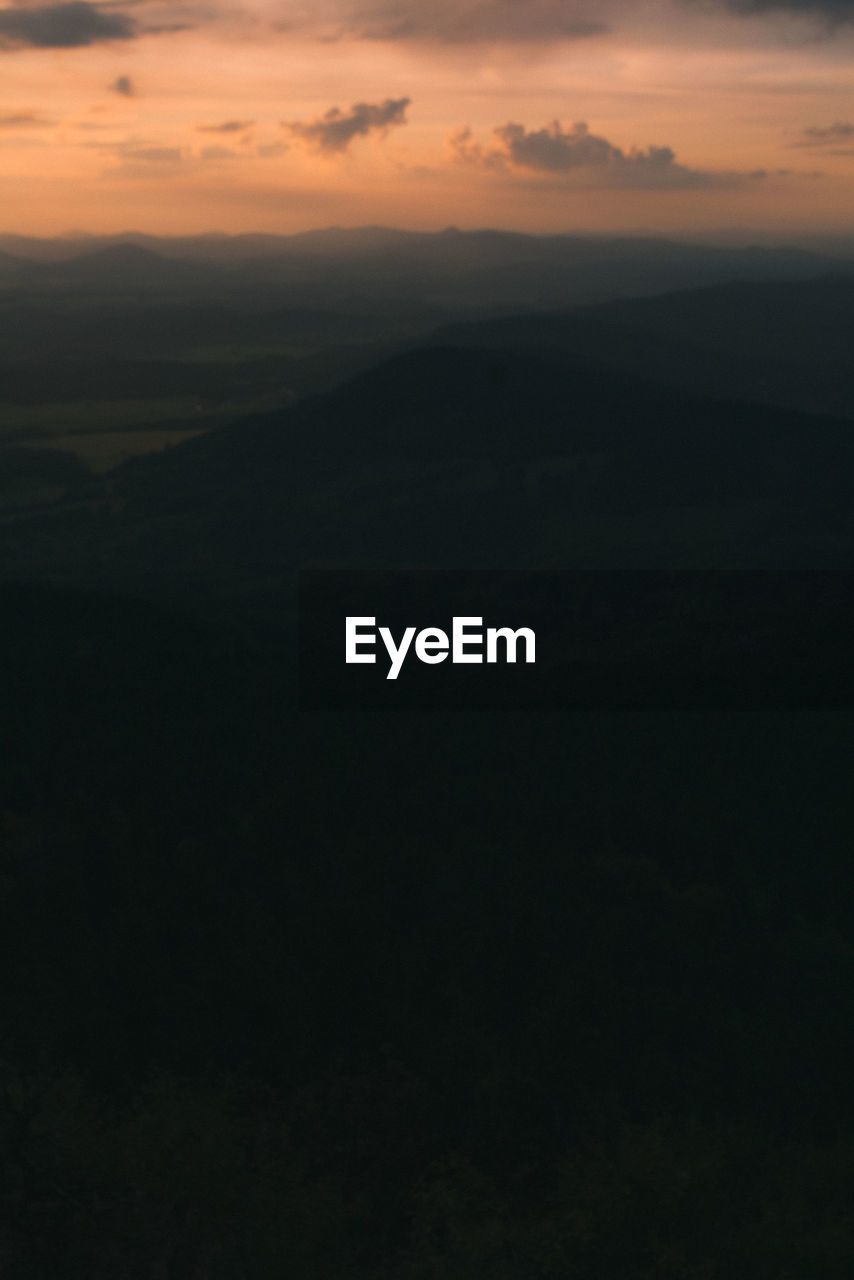 SCENIC VIEW OF SILHOUETTE LANDSCAPE AGAINST ORANGE SKY