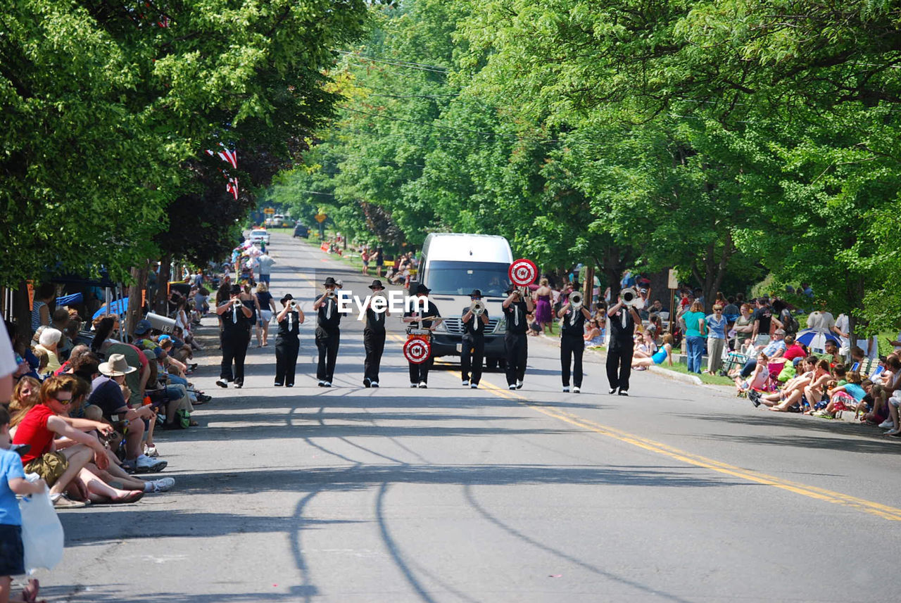 GROUP OF PEOPLE ON ROAD