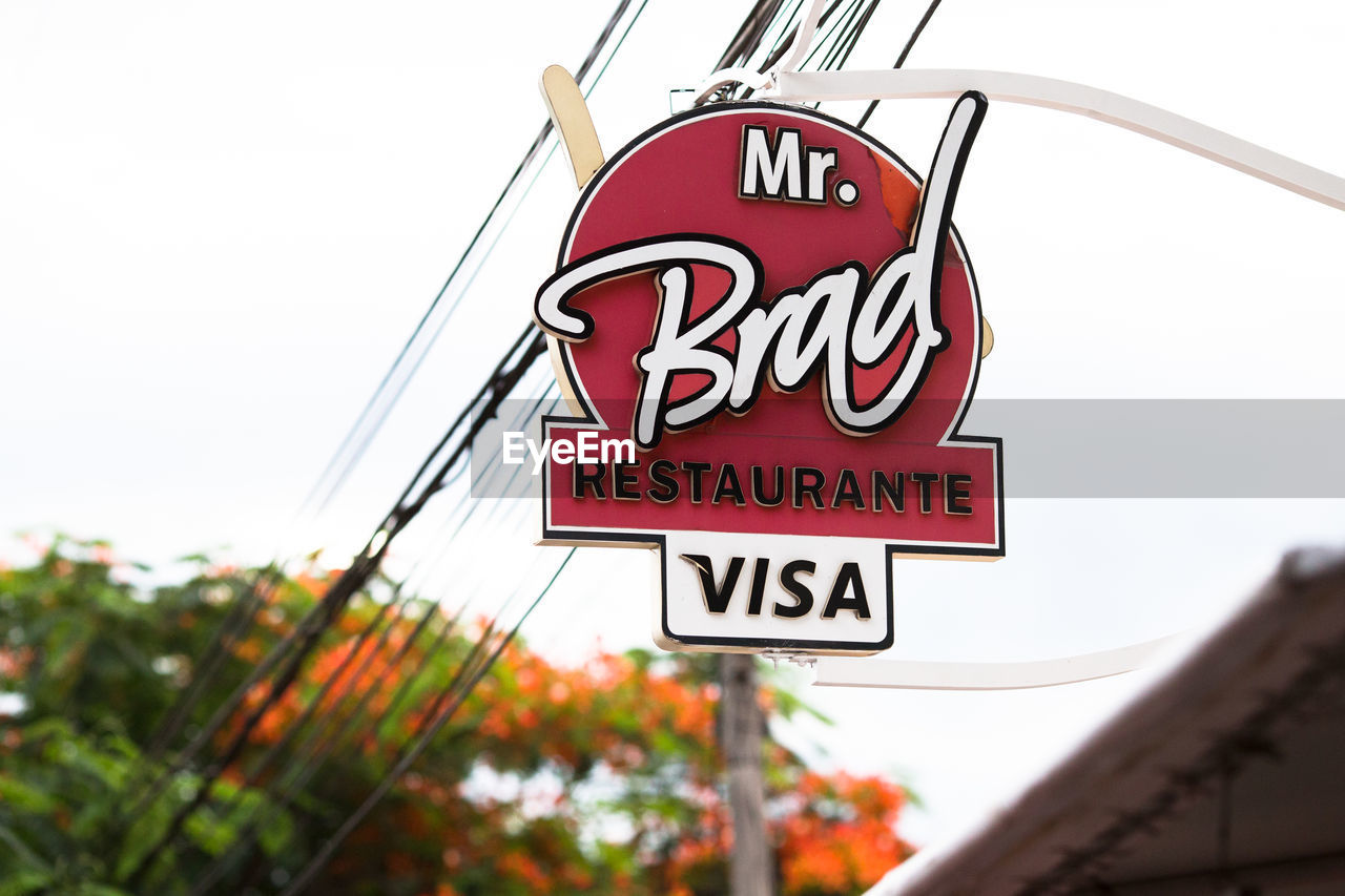 LOW ANGLE VIEW OF SIGN AGAINST CLEAR SKY