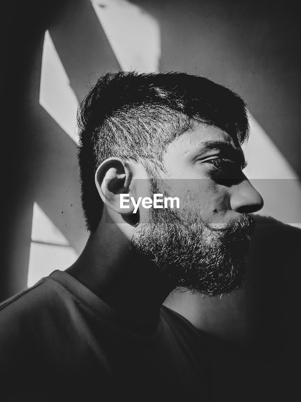 Portrait of young man looking away