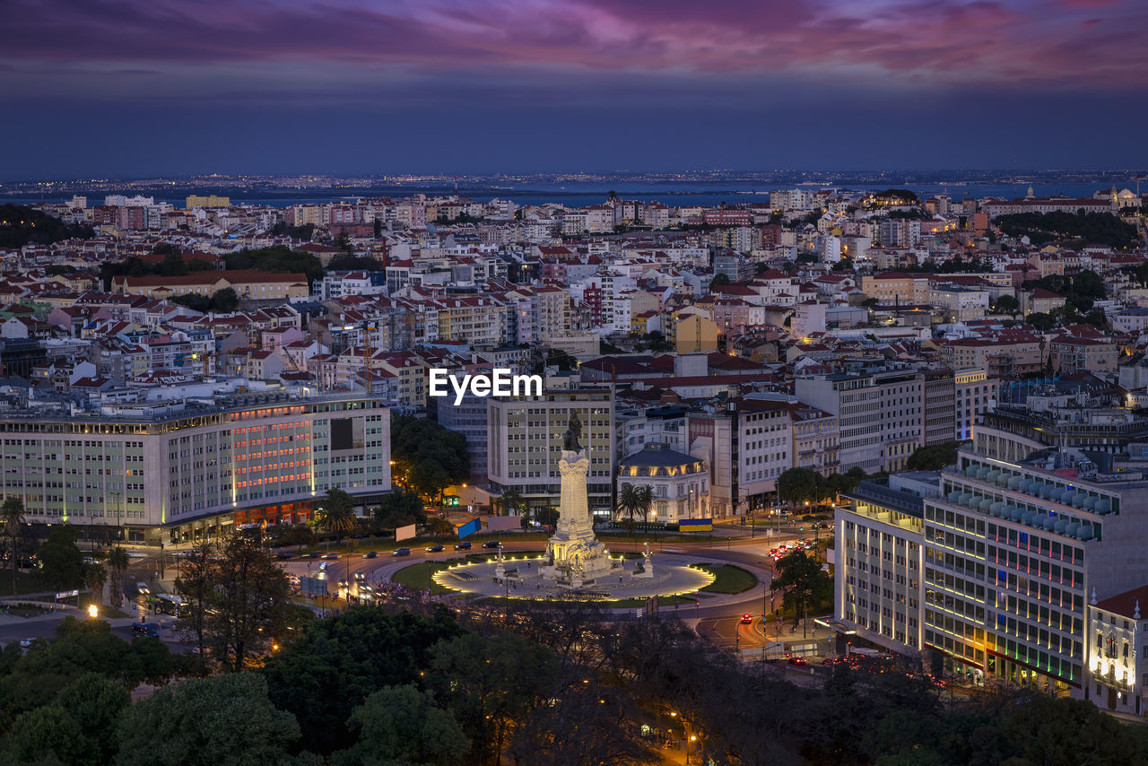 high angle view of illuminated buildings in city