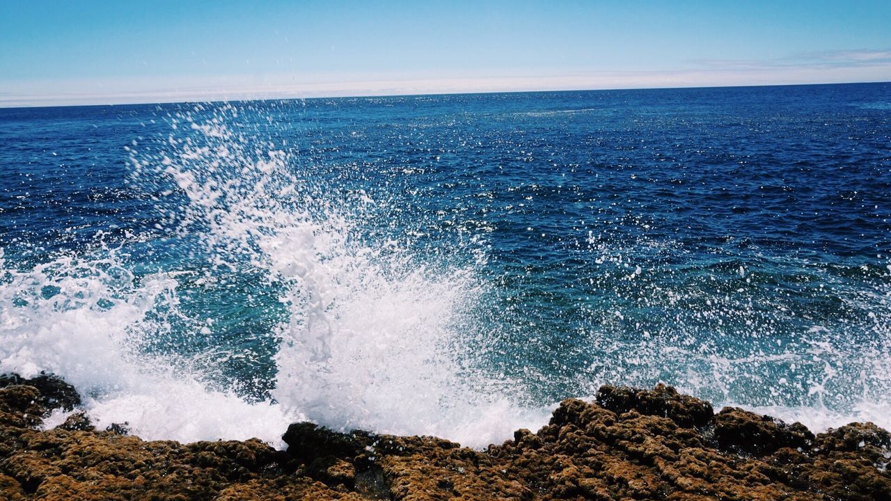 Scenic view of sea against clear sky