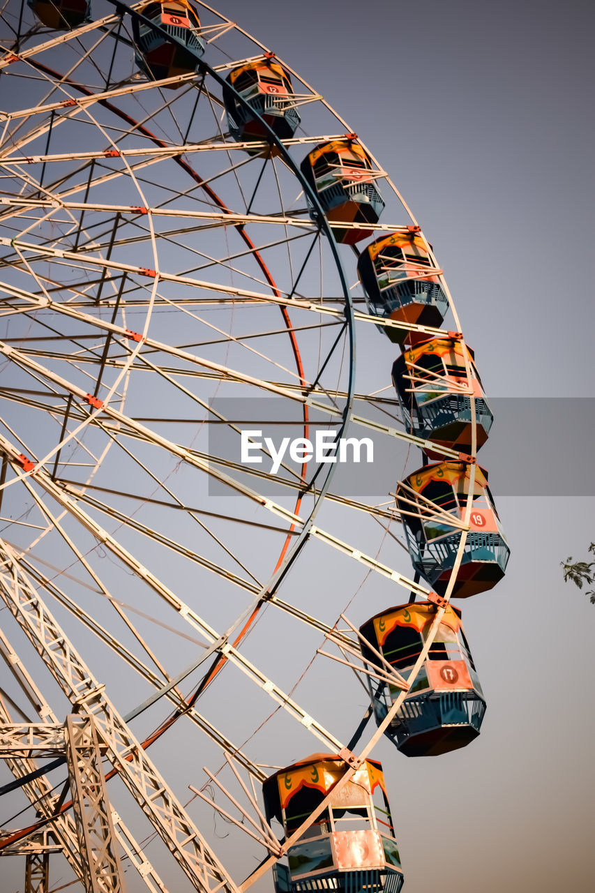 Closeup of multi-coloured giant wheel during dussehra mela in delhi, india. bottom view giant wheel