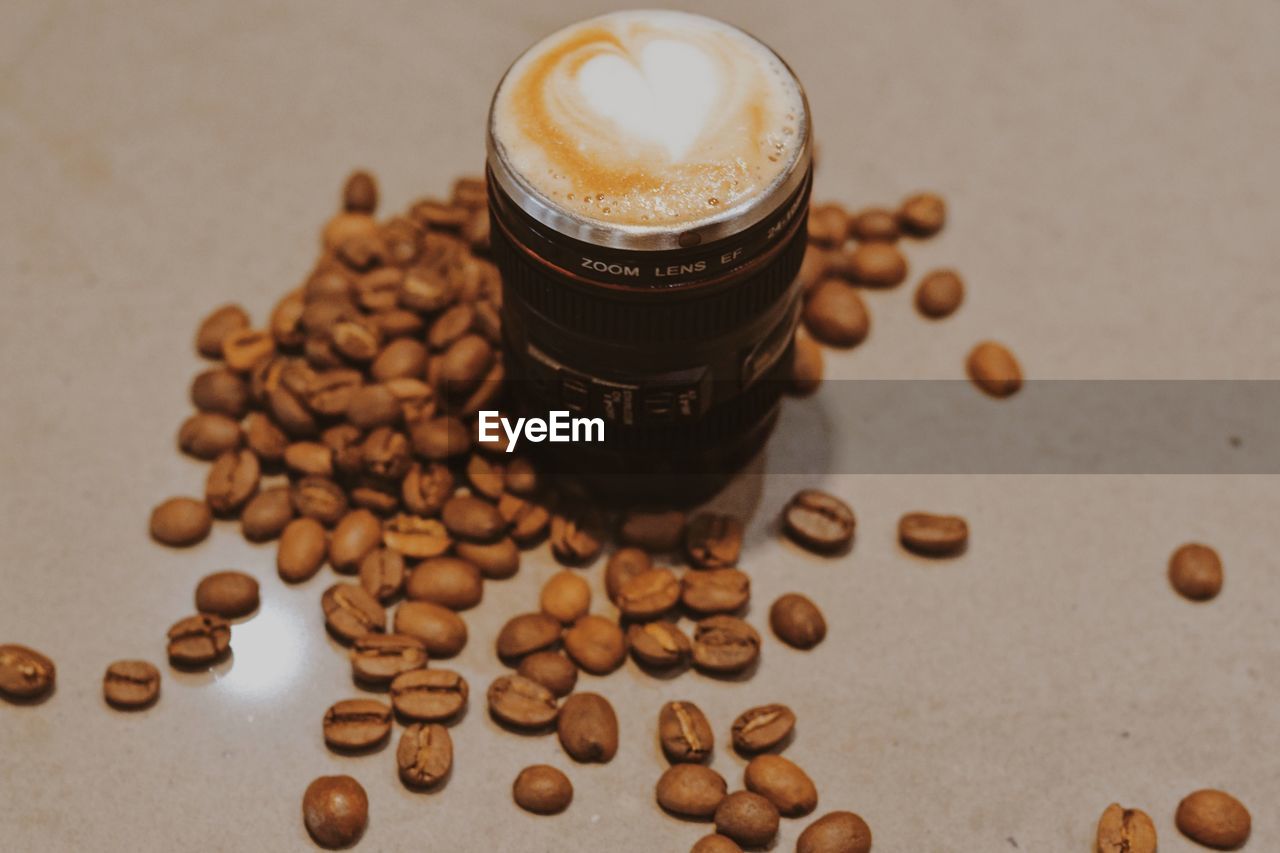 HIGH ANGLE VIEW OF COFFEE CUP AND COOKIES ON TABLE