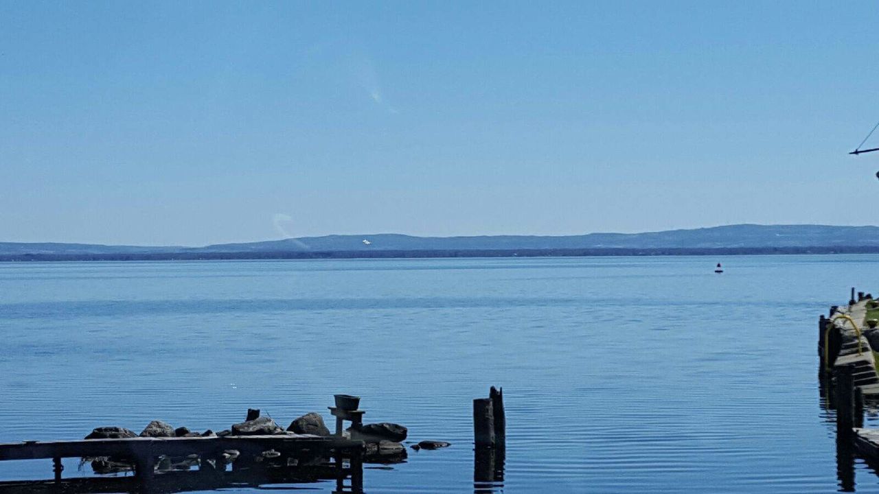 SCENIC VIEW OF CALM SEA AGAINST CLEAR SKY