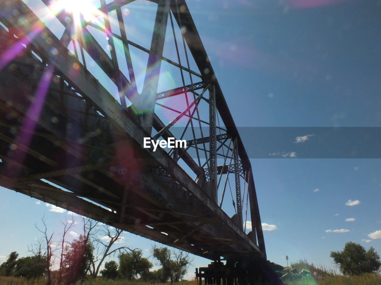 LOW ANGLE VIEW OF SUSPENSION BRIDGE AGAINST SKY