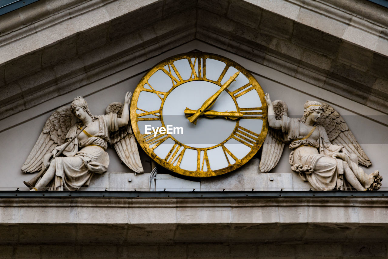 Low angle view of clock tower in building