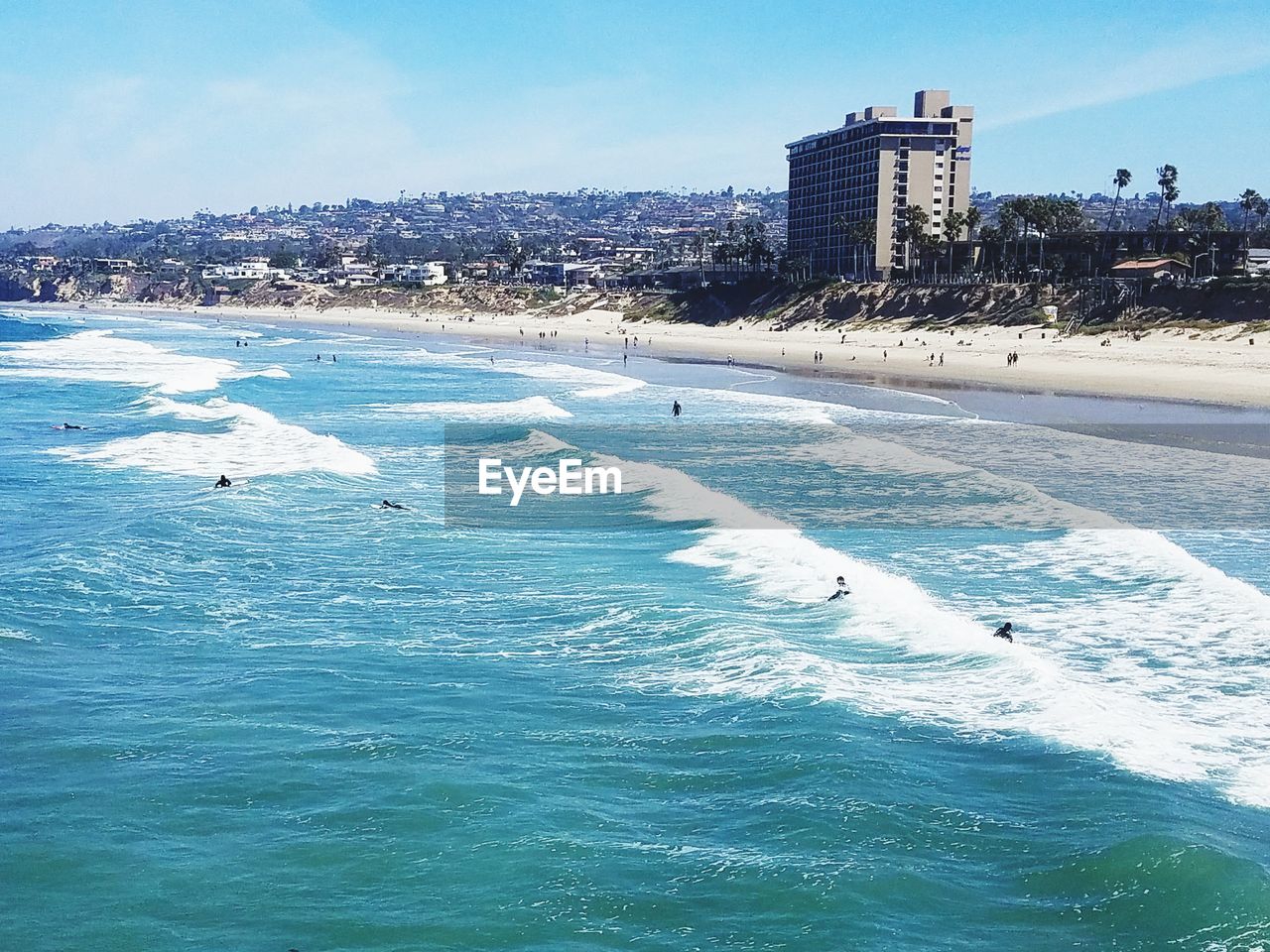 Panoramic view of beach and buildings against sky